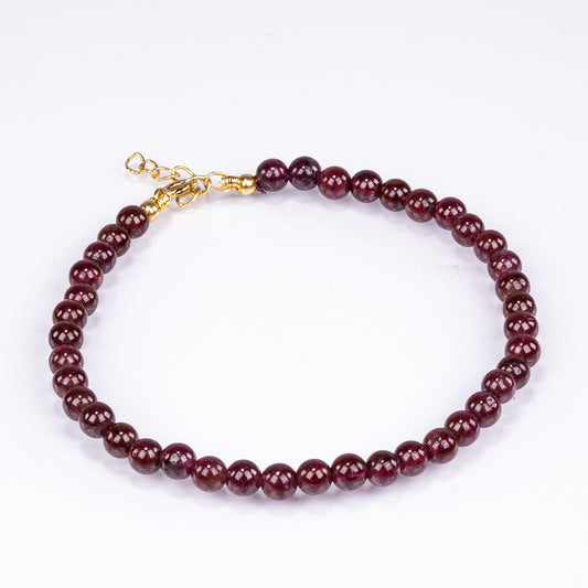 Bransoletka srebrna pozłacana z czerwonym granatem